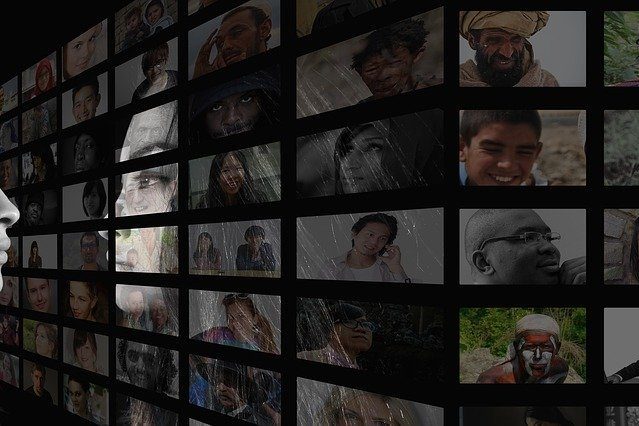 Woman looking at pictures of various people